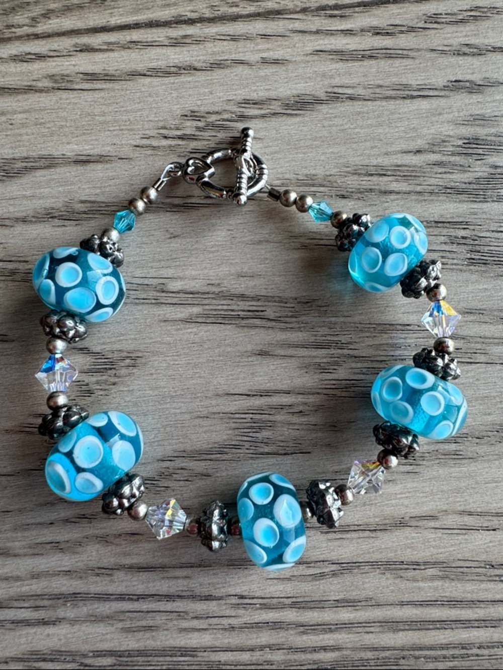 Handcrafted Blue Glass Bead Bracelet with Swarovski Crystals and Silver Accents